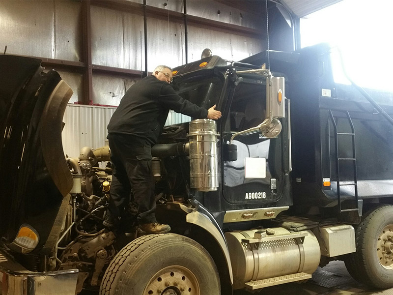 Winshield being replaced in Dump Truck